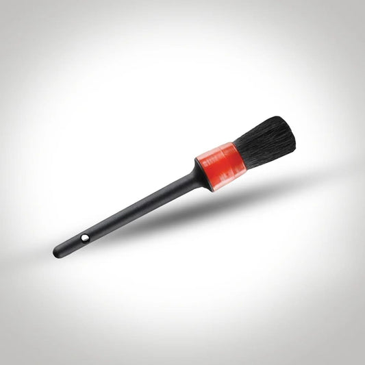 Soft-bristle detailing brush for cleaning car interiors, vents, emblems, and hard-to-reach areas.